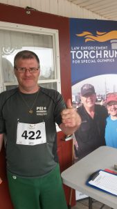 Special Olympics PEI Athlete, Chris Arsenault gives a thumbs up to the May Fun Run event